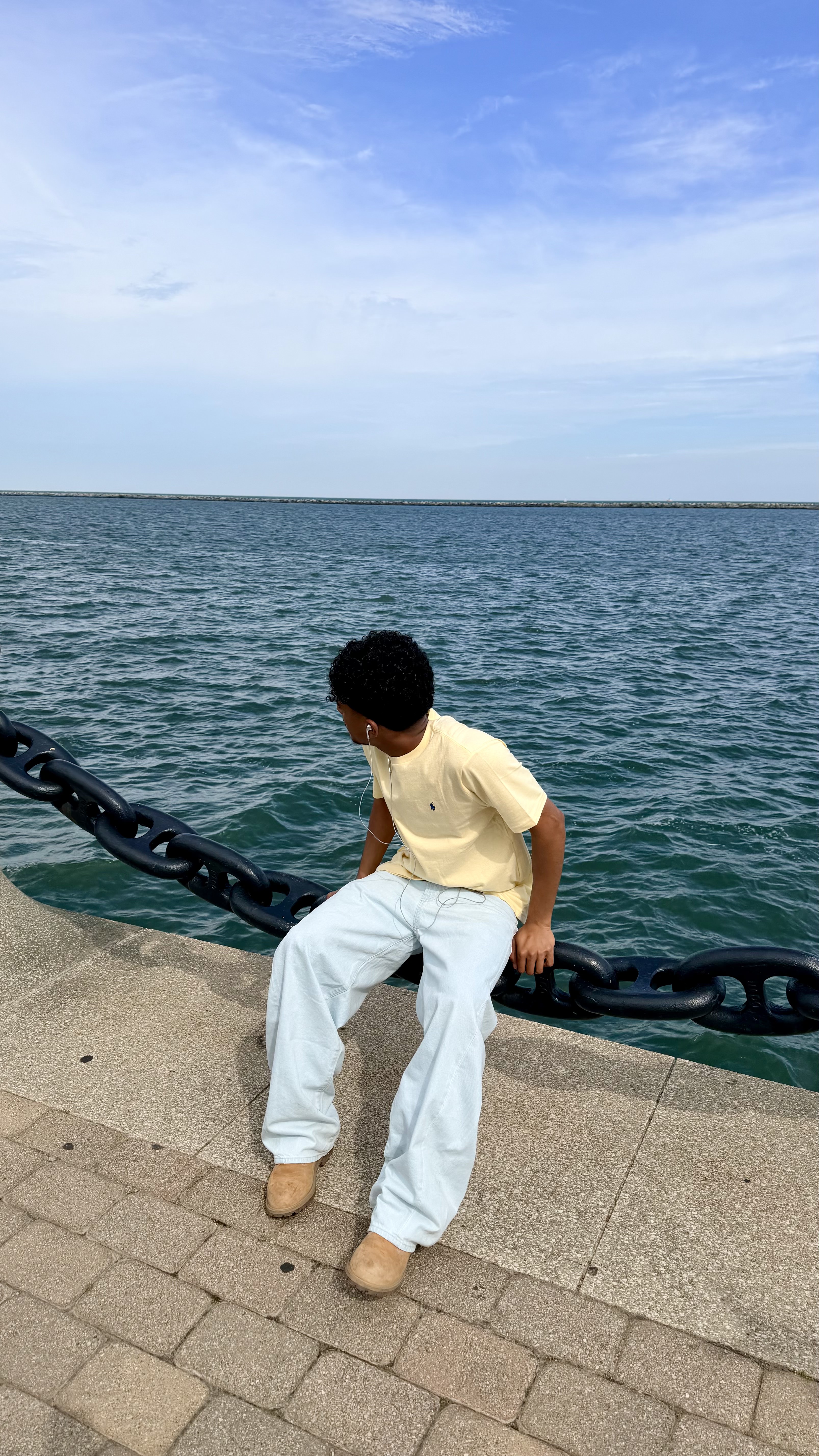 Wearing earphones by the sea